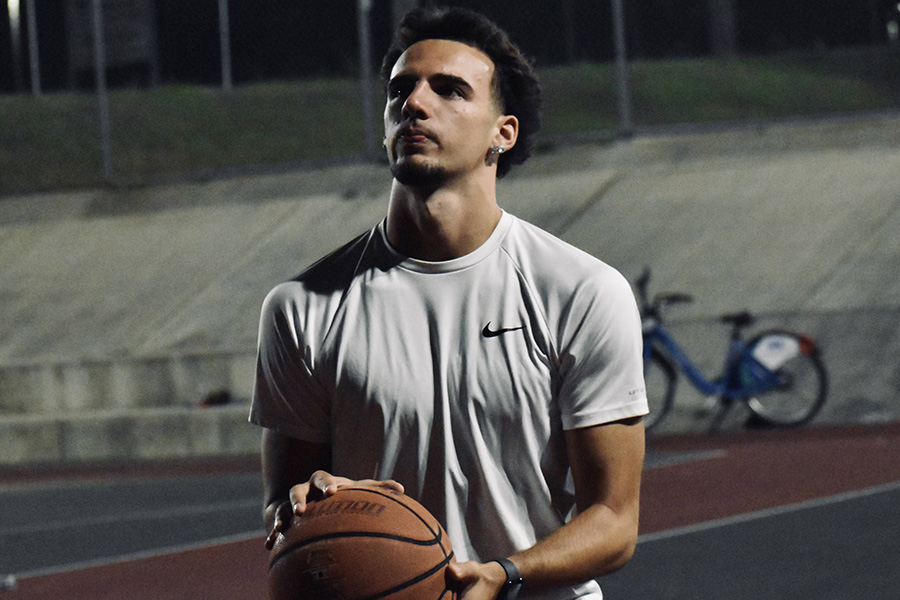 Student Nathan Rubin Holding a Basketball