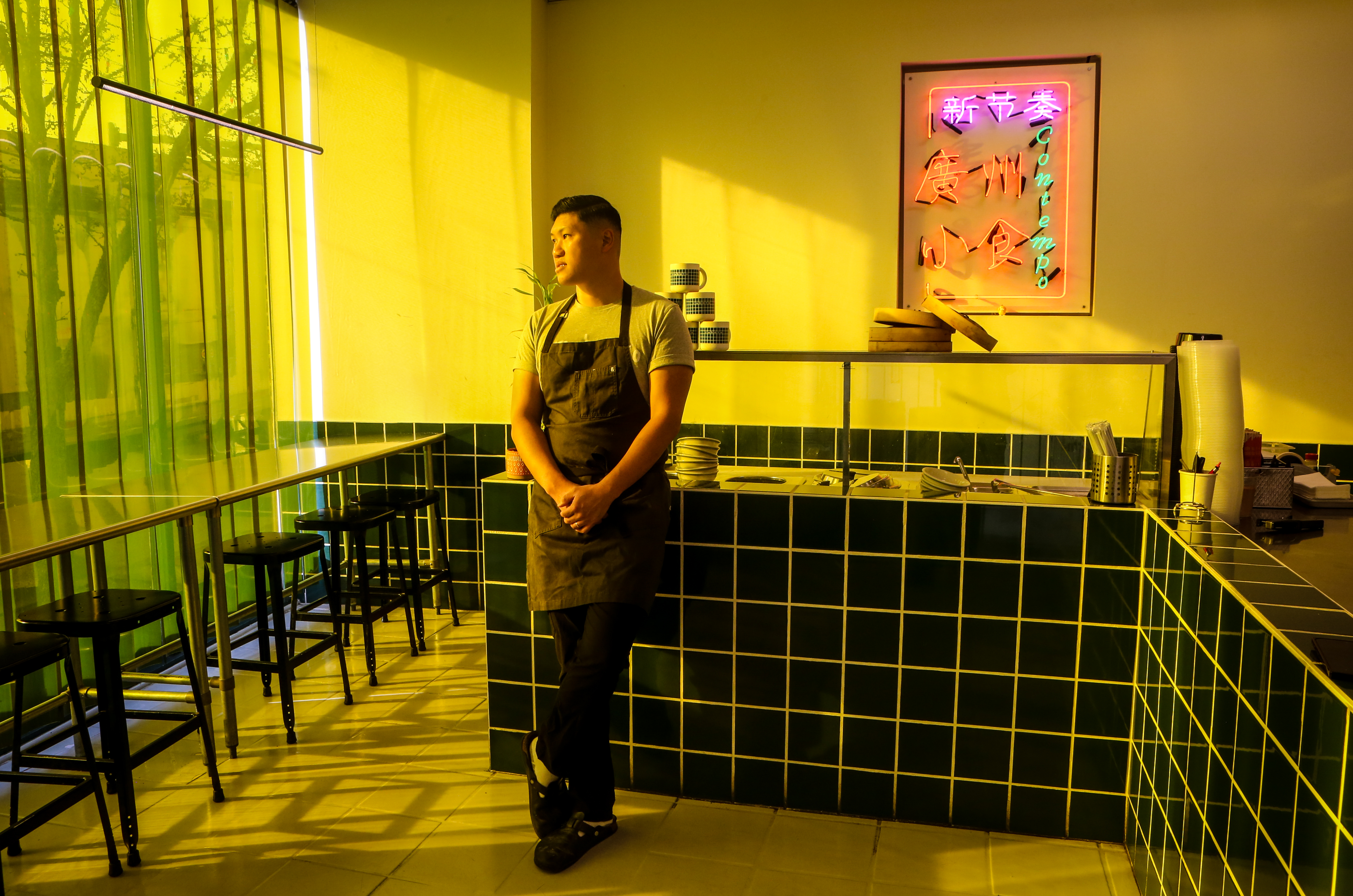 A man standing in a restaurant
